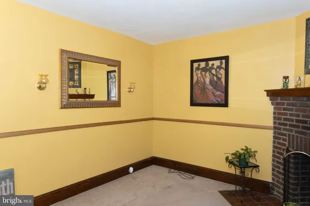 a view of a hallway with paintings on the wall