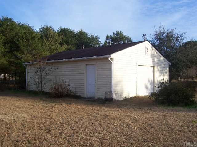 4832 Buffalo Road Selma, NC 27576 - Photo 3 of 12 Garage/workshop wired. Lots of storage & gutters.