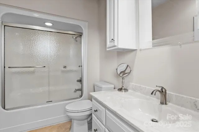 a wooden bench sitting next to a lake