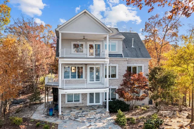 a view of a lake with a table and chairs