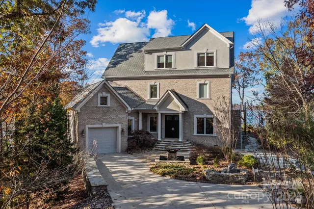 a living room with furniture a rug and a chandelier