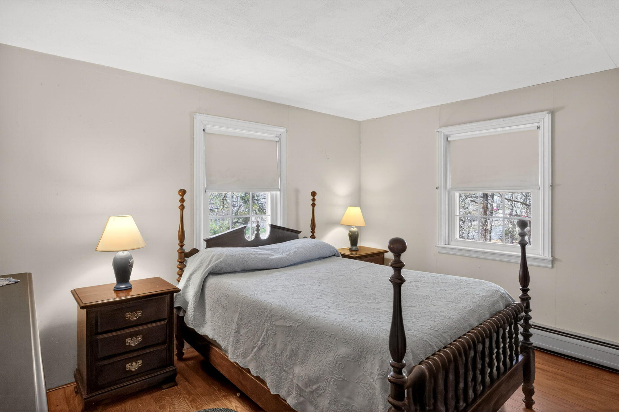 20 Fresh Brook Lane, Unit A Wellfleet, MA 02667 - Photo 12 of 35 a bedroom with a bed and a lamp on table