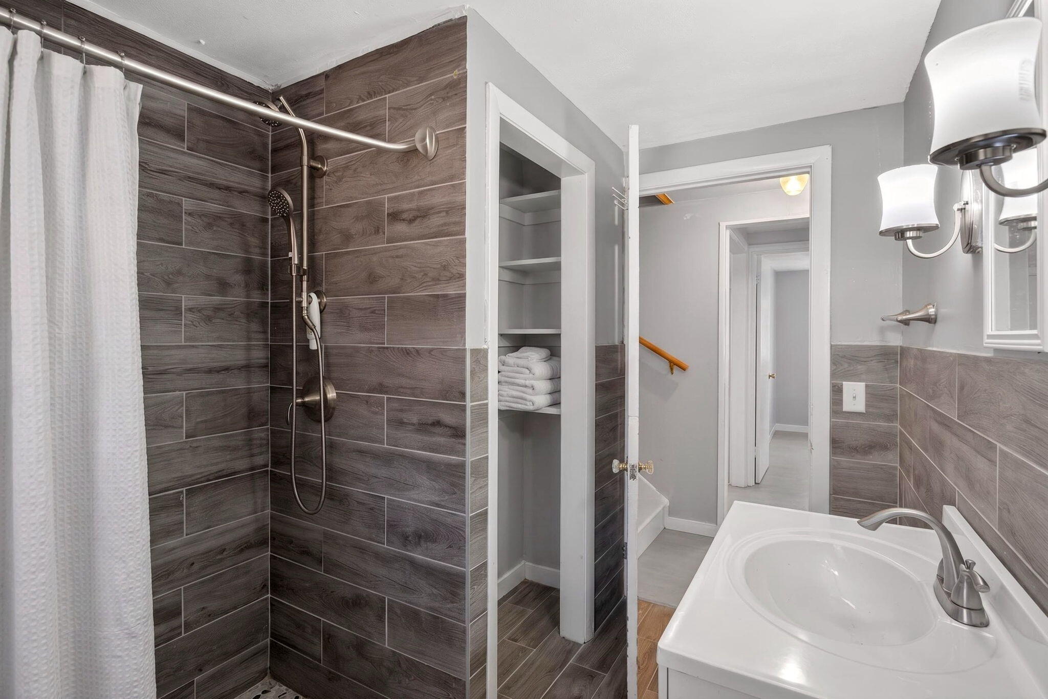 20 Fresh Brook Lane, Unit A Wellfleet, MA 02667 - Photo 15 of 35 a bathroom with a sink and shower