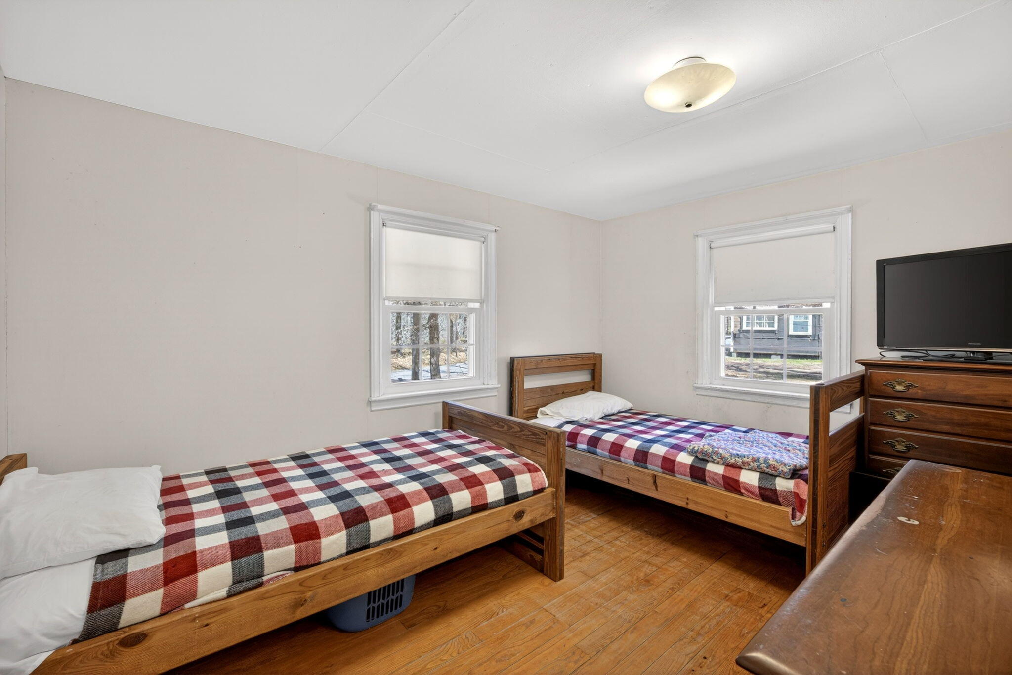 20 Fresh Brook Lane, Unit A Wellfleet, MA 02667 - Photo 16 of 35 a bedroom with a bed and a flat screen tv