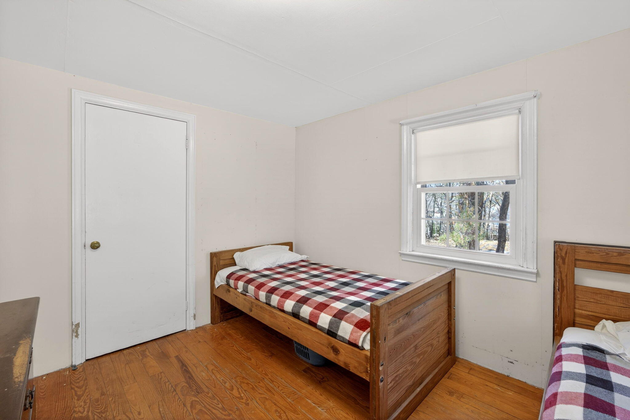 20 Fresh Brook Lane, Unit A Wellfleet, MA 02667 - Photo 17 of 35 a bedroom with a bed and wooden floor