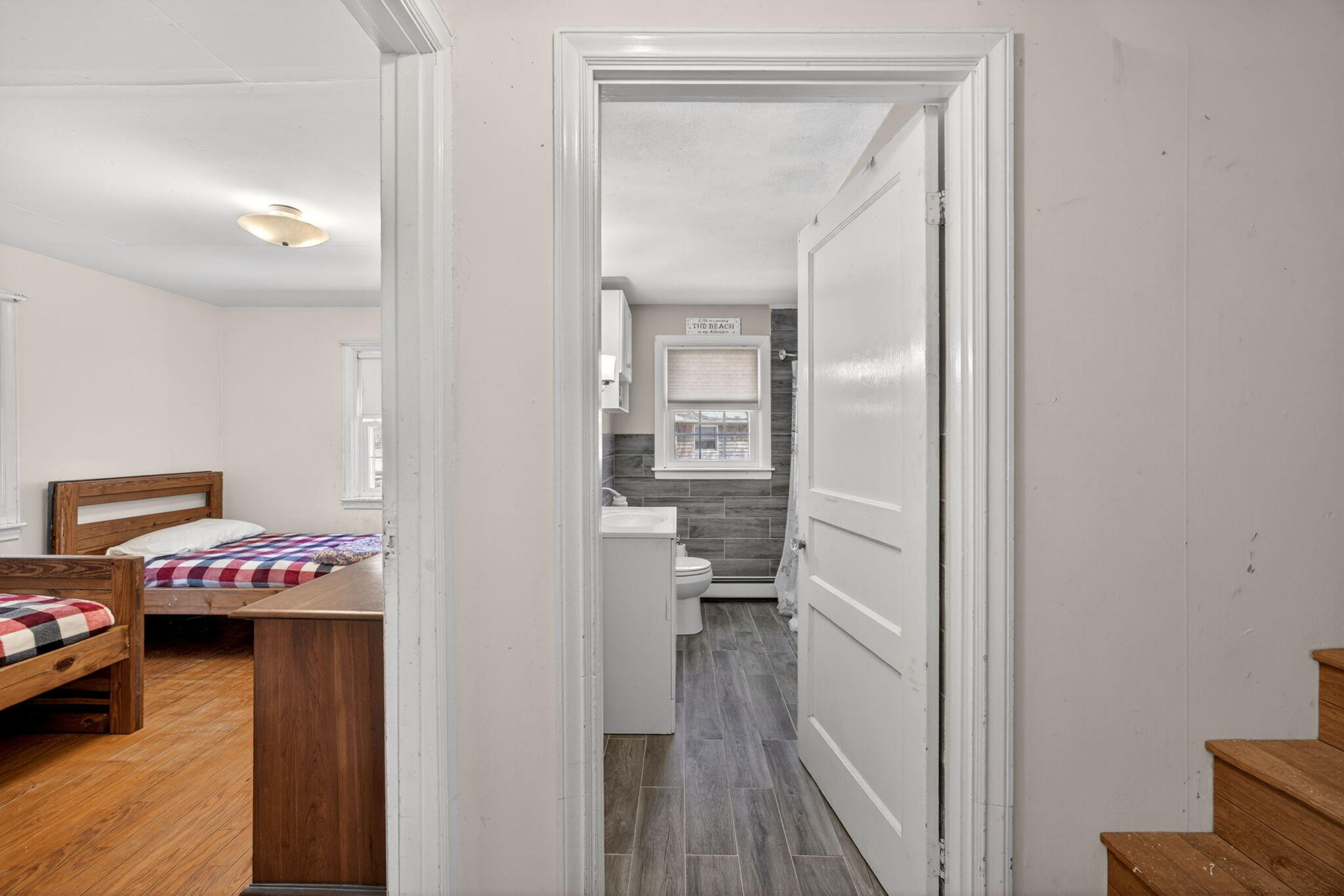 20 Fresh Brook Lane, Unit A Wellfleet, MA 02667 - Photo 19 of 35 a hallway with table and closet