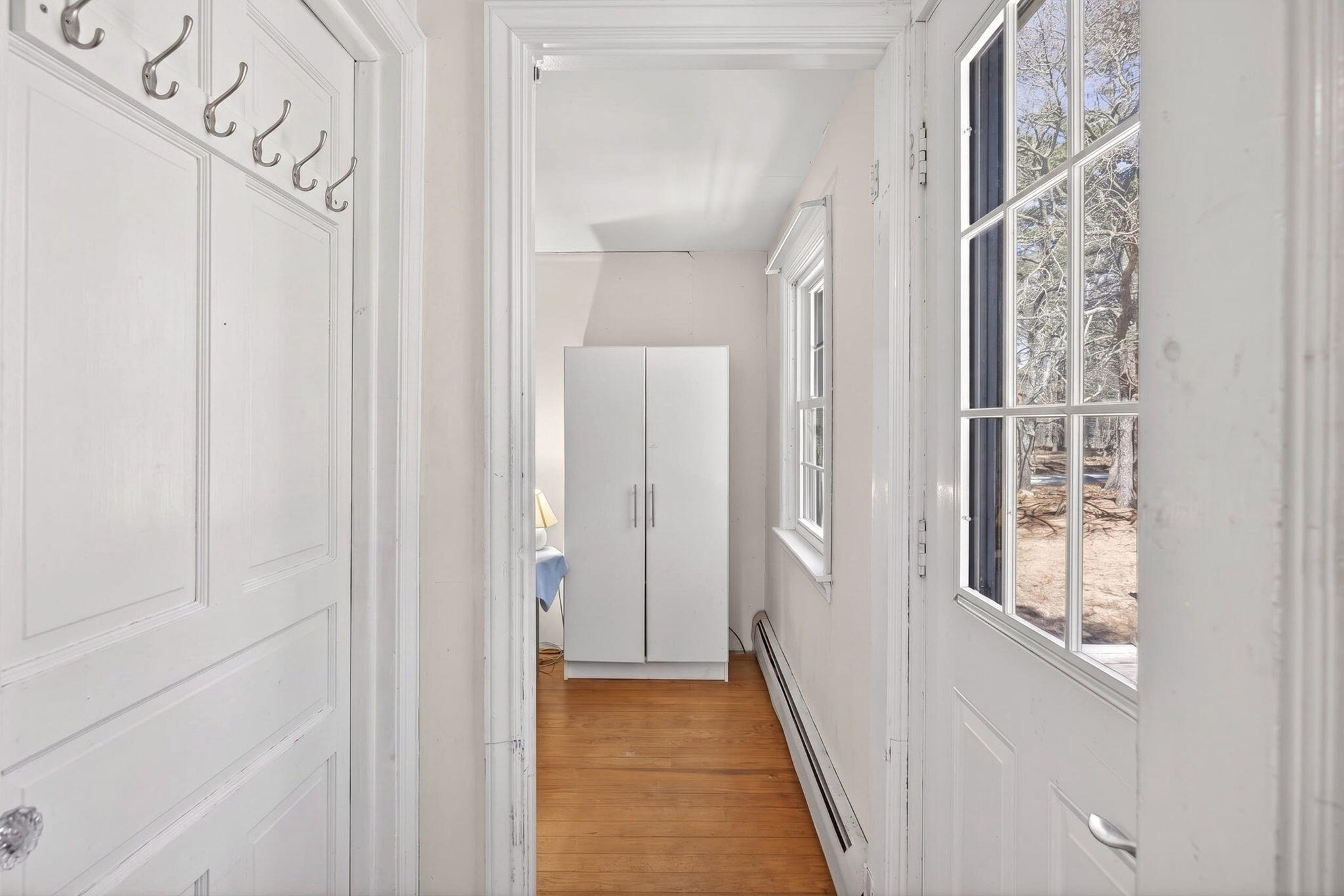 20 Fresh Brook Lane, Unit A Wellfleet, MA 02667 - Photo 22 of 35 a view of a hallway with wooden floor and entryway