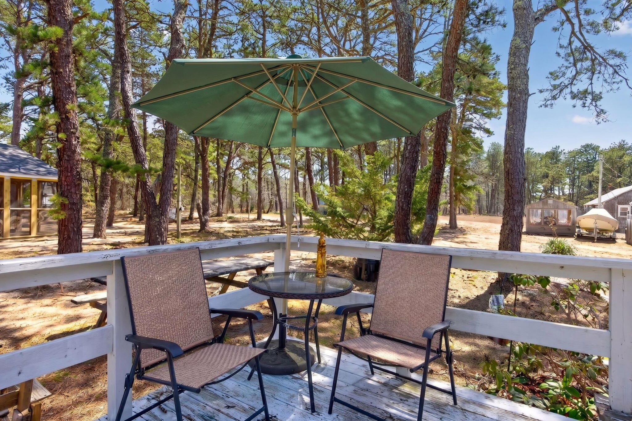 20 Fresh Brook Lane, Unit A Wellfleet, MA 02667 - Photo 28 of 35 a patio with a yard table and chairs