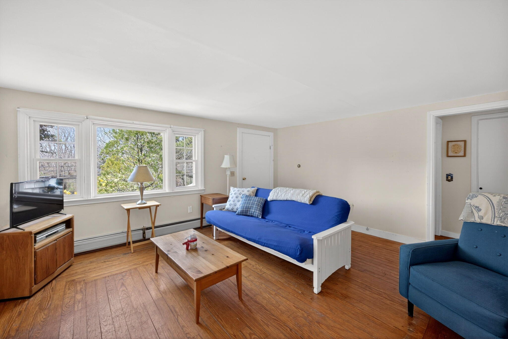 20 Fresh Brook Lane, Unit A Wellfleet, MA 02667 - Photo 4 of 35 a living room with furniture and a window