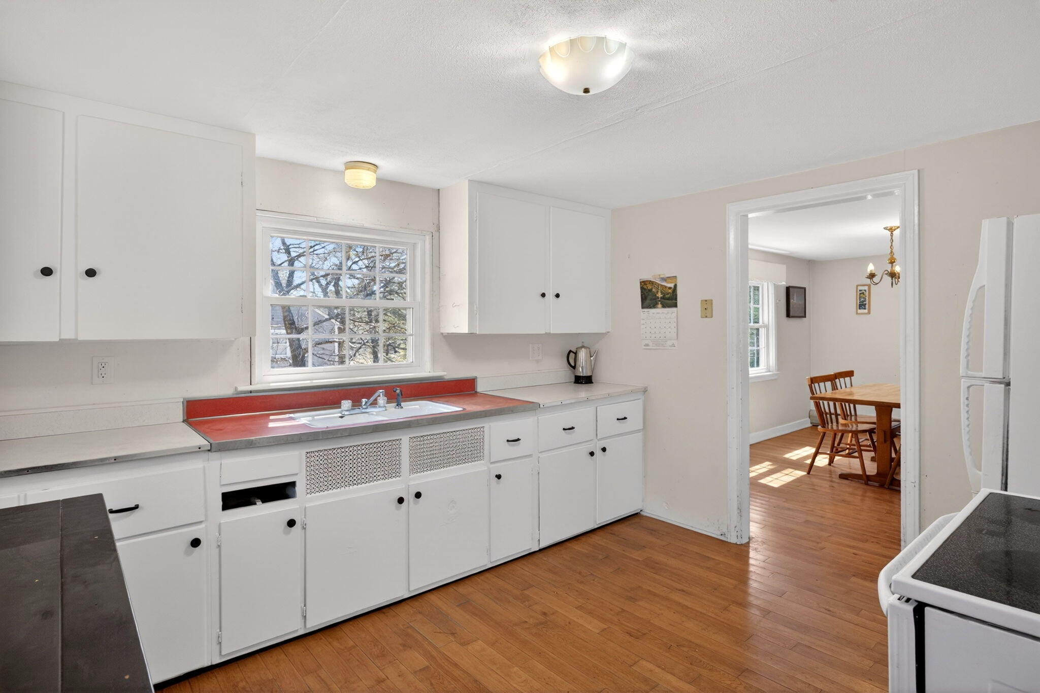20 Fresh Brook Lane, Unit A Wellfleet, MA 02667 - Photo 9 of 35 a kitchen with granite countertop a sink and cabinets