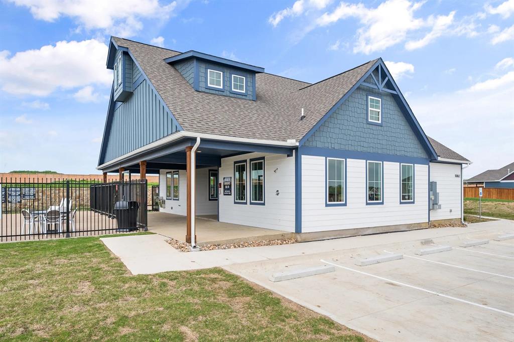 3514 Randall Terrace Grand Prairie, TX 76065 - Photo 2 of 7 a view of a house with floor to ceiling windows and a big yard