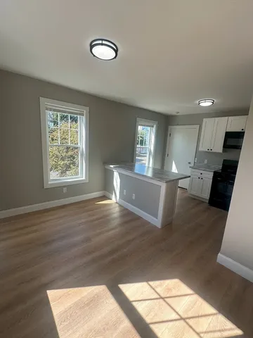a view of a kitchen cabinets and wooden floor