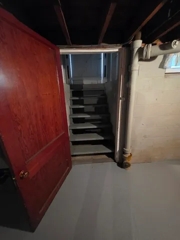 a view of walk in closet with clothes