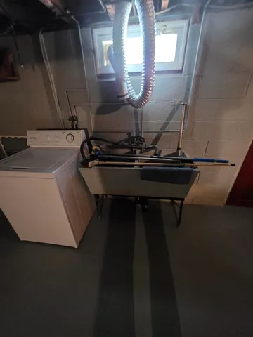 a room with a table chairs and a stove