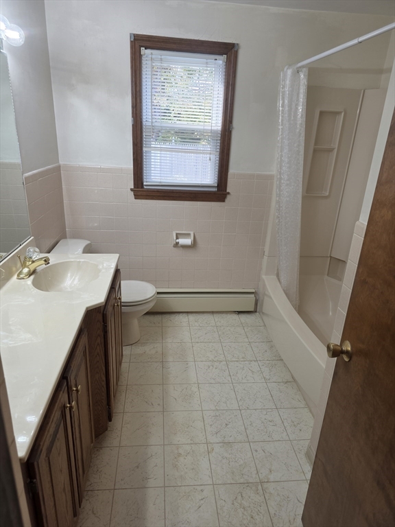 80 Ann Street Chicopee, MA 01020 - Photo 9 of 20 a bathroom with a sink a toilet and a mirror