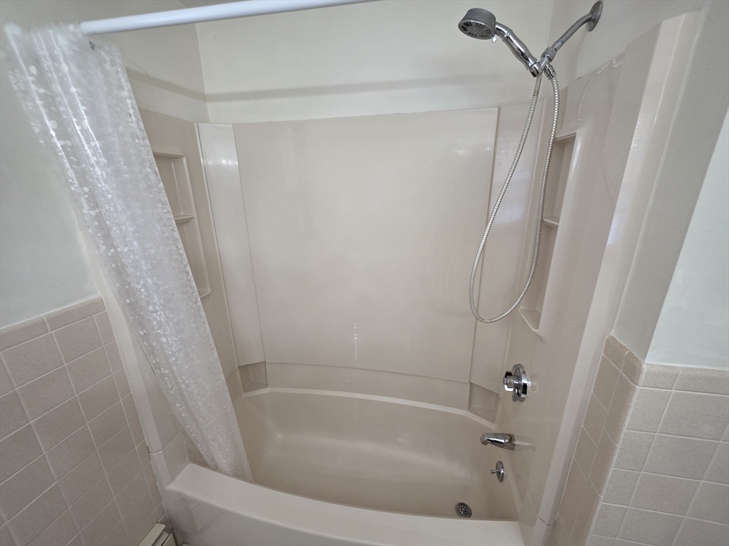 80 Ann Street Chicopee, MA 01020 - Photo 10 of 20 a bathroom with a bathtub