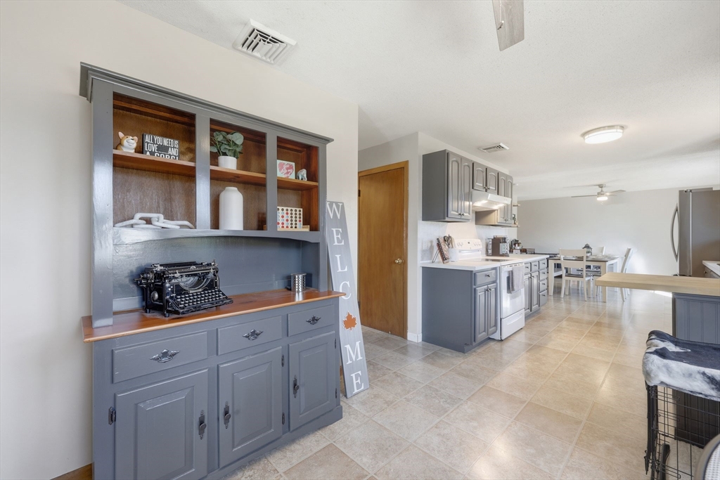 20 Connolly Street Springfield, MA 01151 - Photo 12 of 41 a kitchen with stainless steel appliances granite countertop a refrigerator and cabinets