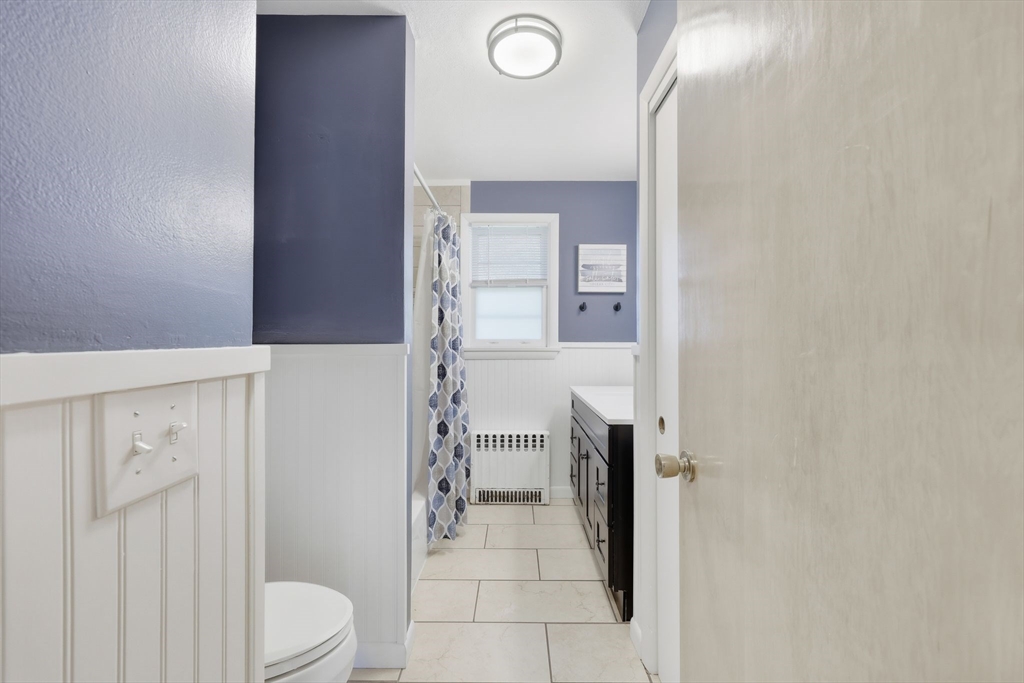 20 Connolly Street Springfield, MA 01151 - Photo 28 of 41 a bathroom with a sink a toilet and shower