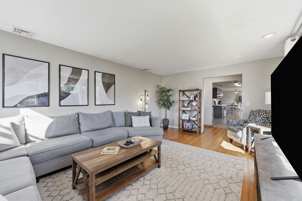 20 Connolly Street Springfield, MA 01151 - Photo 9 of 41 a living room with furniture a flat screen tv and a large window