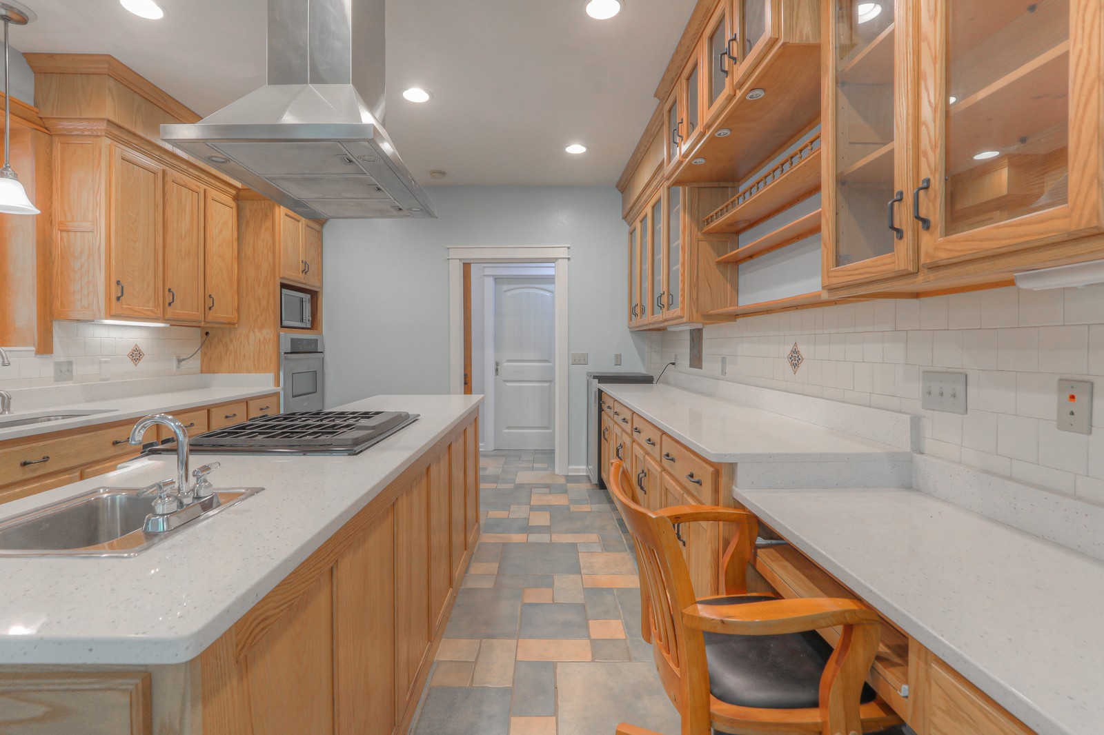 807 Timberwood Trace Monteagle, TN 37356 - Photo 16 of 64 a kitchen with granite countertop a sink and a stove top oven