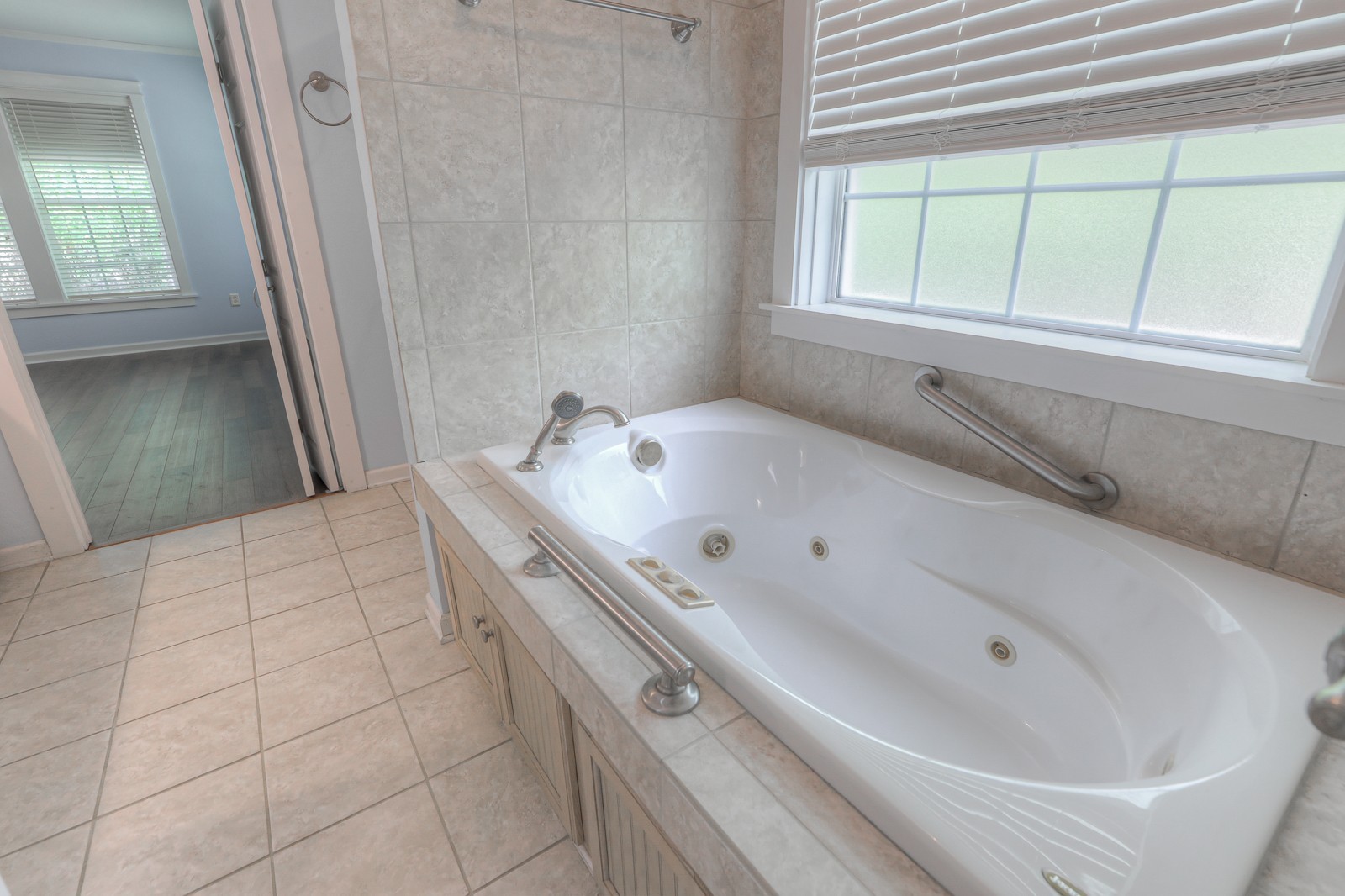 807 Timberwood Trace Monteagle, TN 37356 - Photo 25 of 64 a bathroom with a bathtub and a window