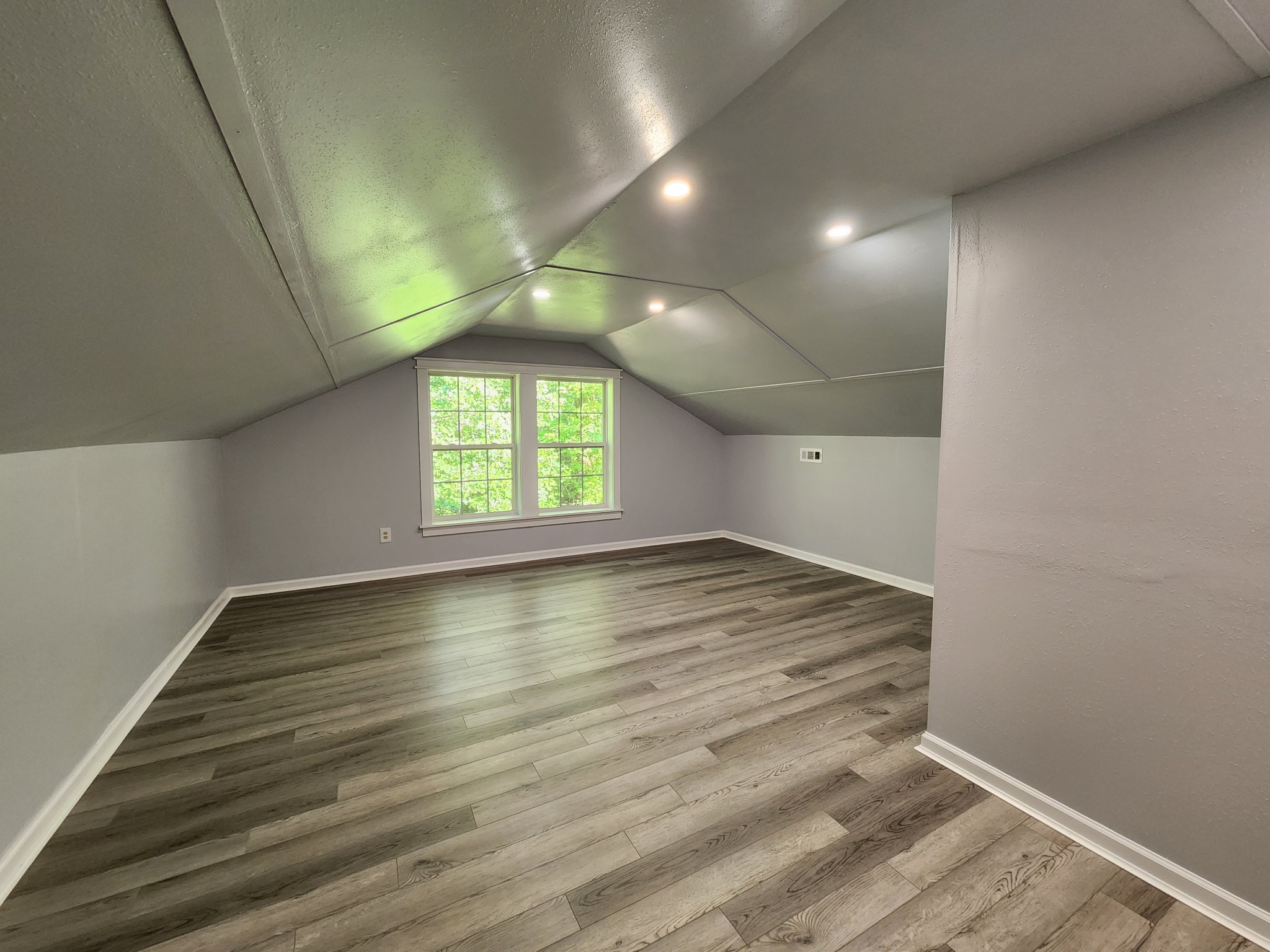 807 Timberwood Trace Monteagle, TN 37356 - Photo 39 of 64 an empty room with wooden floor and windows