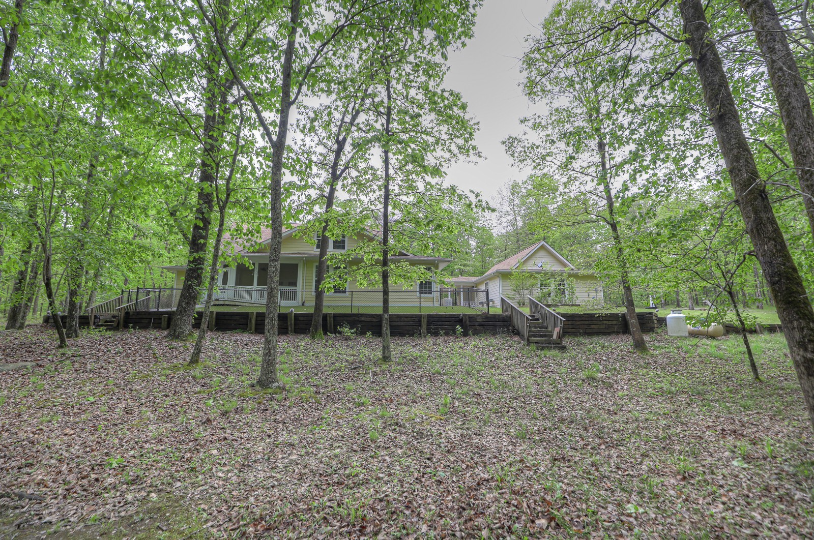 807 Timberwood Trace Monteagle, TN 37356 - Photo 43 of 64 a backyard of a house with lots of green space