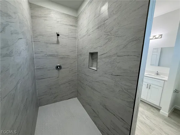 a bathroom with a shower and toilet