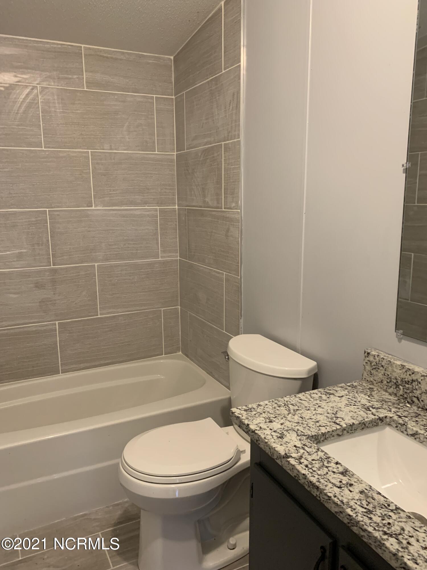 8574 Revell Road Kenly, NC 27542 - Photo 12 of 16 hall bath