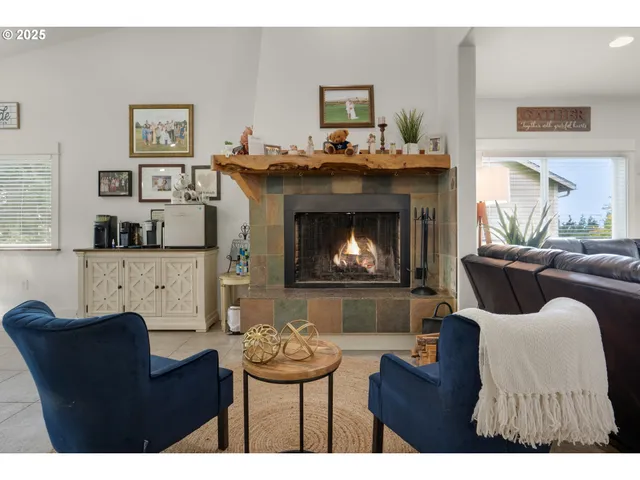 a view of a dining room with furniture a chandelier and window