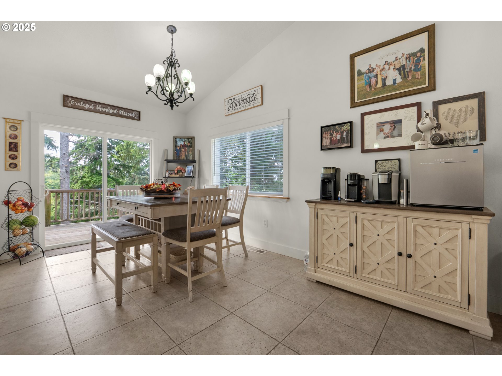 2344 Royal View Drive Seaside, OR 97138 - Photo 13 of 38 a view of a dining room with furniture a chandelier and window
