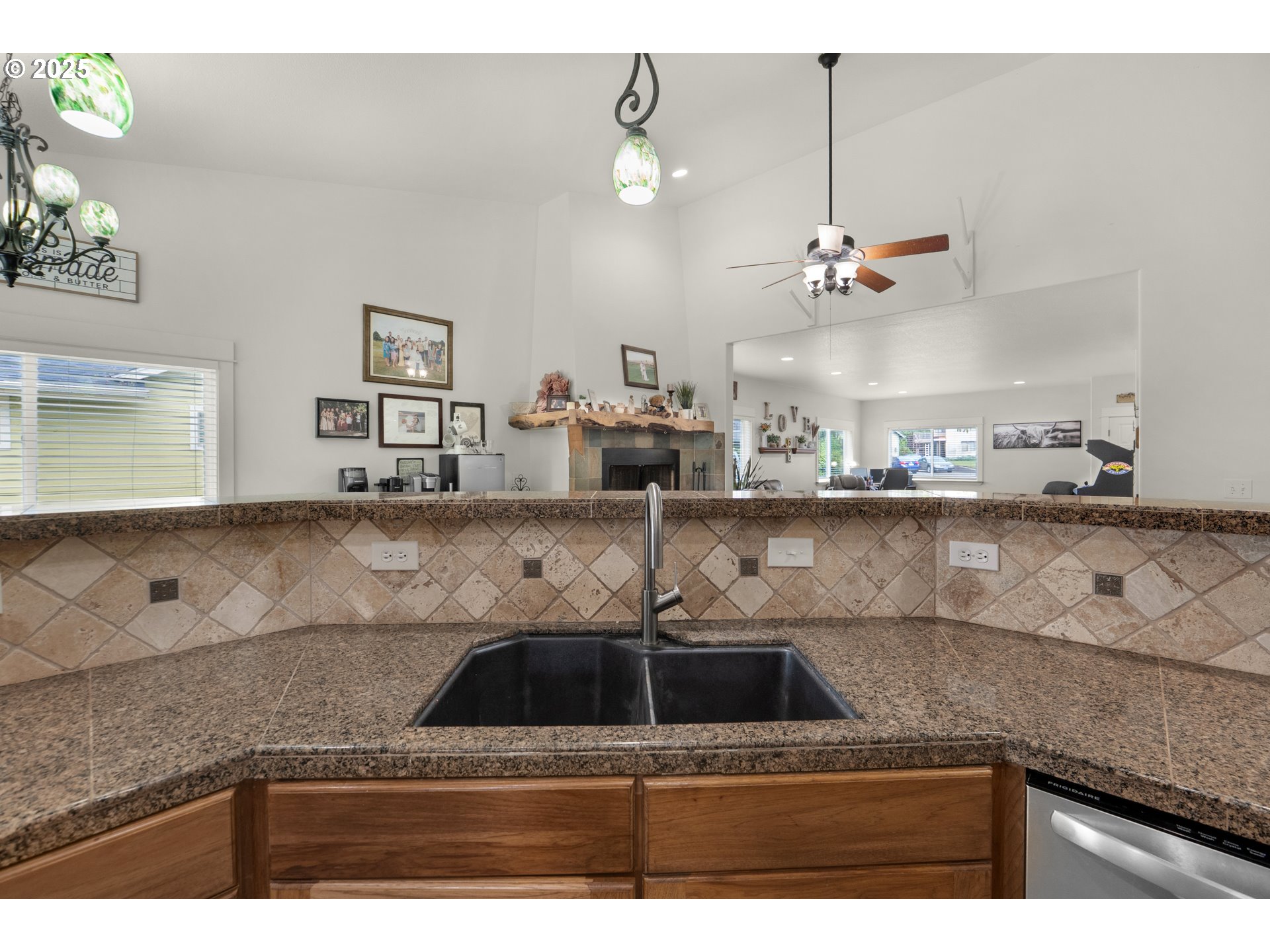 2344 Royal View Drive Seaside, OR 97138 - Photo 20 of 38 a kitchen with kitchen island a counter top space cabinets and stainless steel appliances