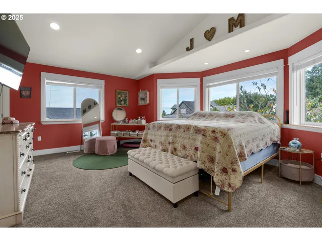 a bedroom with a bed window and couch