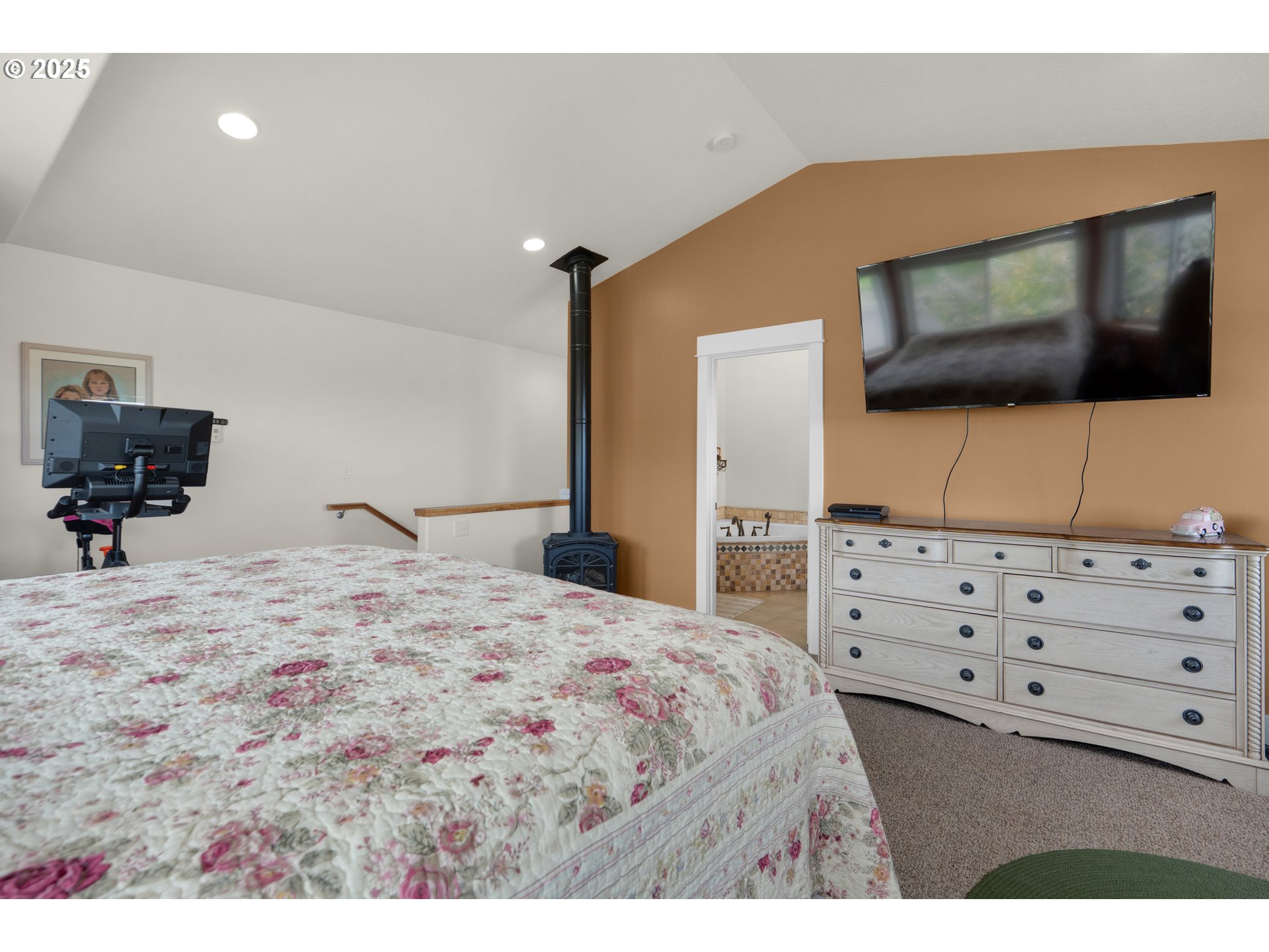 2344 Royal View Drive Seaside, OR 97138 - Photo 27 of 38 a bedroom with a bed and a flat screen tv