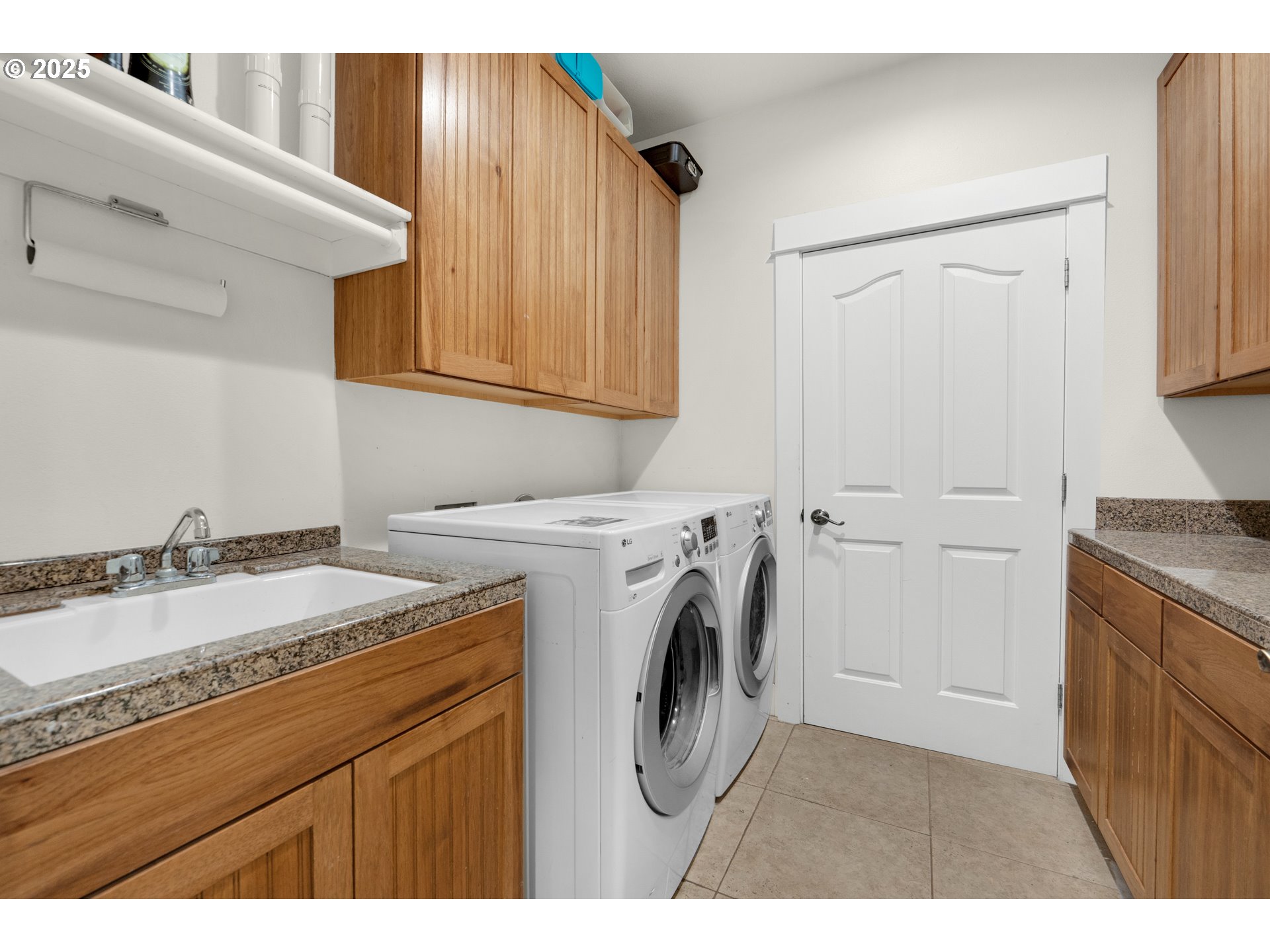 2344 Royal View Drive Seaside, OR 97138 - Photo 31 of 38 a utility room with sink dryer and washer