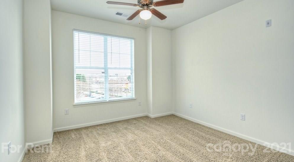 4310 Park Road, Unit 206 Charlotte, NC 28209 - Photo 2 of 13 an empty room with a window