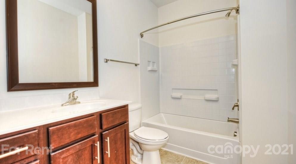 4310 Park Road, Unit 206 Charlotte, NC 28209 - Photo 3 of 13 a bathroom with a sink toilet and shower