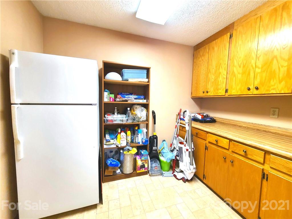 250 Tanner Street Rutherfordton, NC 28139 - Photo 11 of 48 a view of storage and utility room with washer and dryer