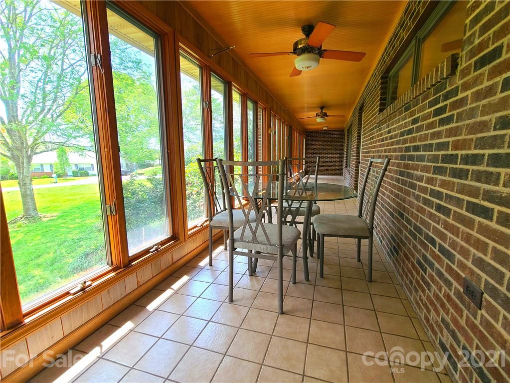 250 Tanner Street Rutherfordton, NC 28139 - Photo 16 of 48 a view of a porch with chairs and backyard