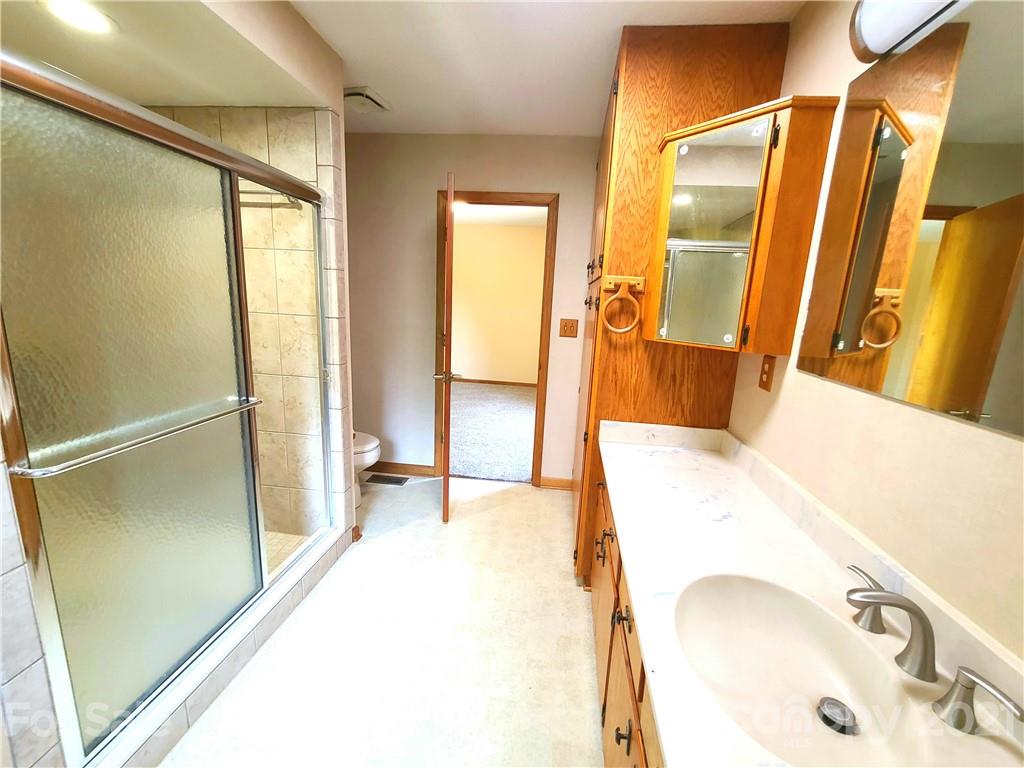 250 Tanner Street Rutherfordton, NC 28139 - Photo 23 of 48 a bathroom with a tub and a sink