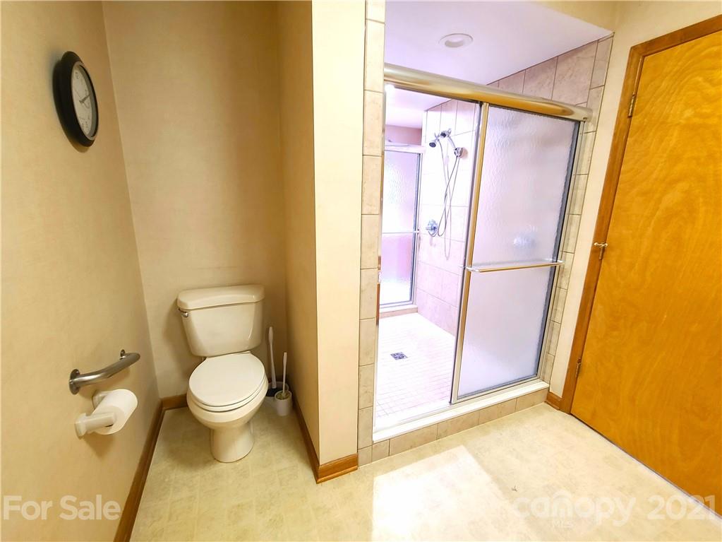 250 Tanner Street Rutherfordton, NC 28139 - Photo 29 of 48 a bathroom with a granite countertop sink toilet and shower