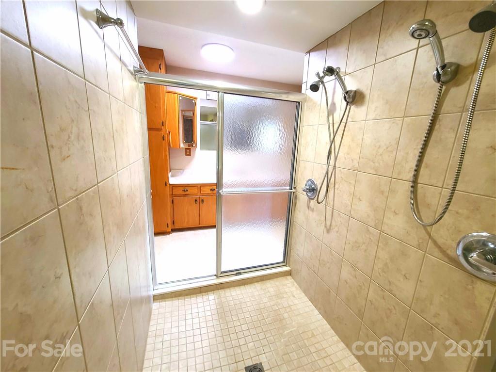 250 Tanner Street Rutherfordton, NC 28139 - Photo 30 of 48 a bathroom with a shower and a glass door