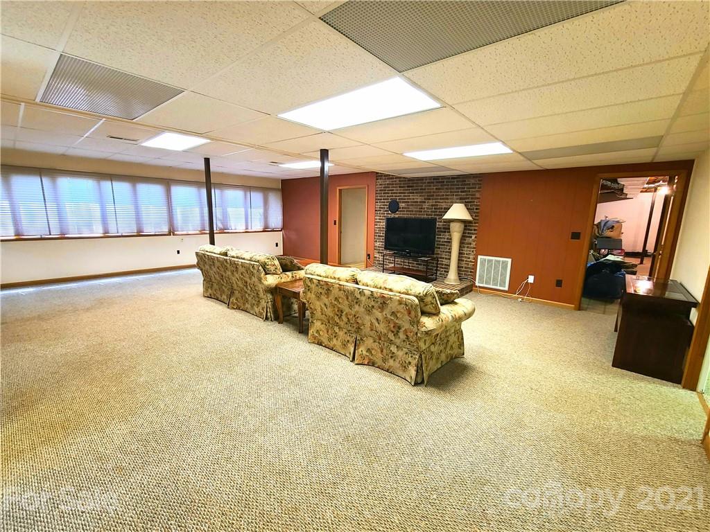 250 Tanner Street Rutherfordton, NC 28139 - Photo 35 of 48 a bed room with furniture and a flat screen tv