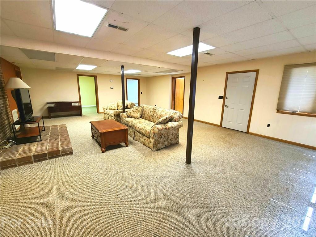 250 Tanner Street Rutherfordton, NC 28139 - Photo 36 of 48 a living room with furniture and a flat screen tv