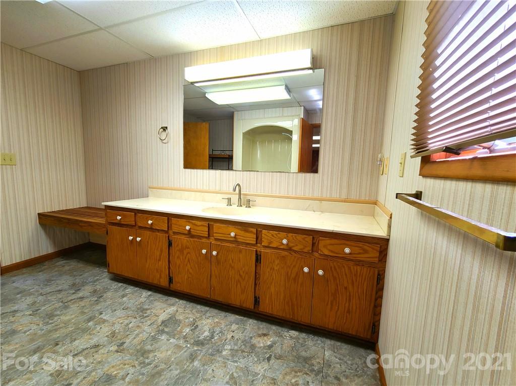 250 Tanner Street Rutherfordton, NC 28139 - Photo 40 of 48 a spacious bathroom with a double vanity sink and a mirror