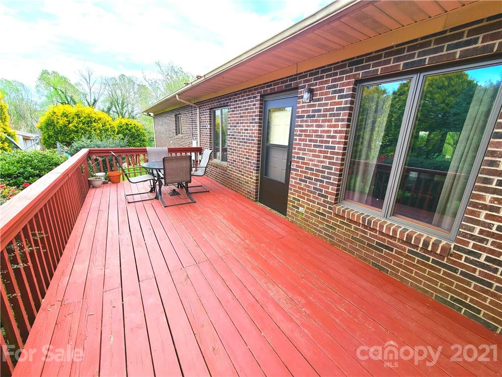 250 Tanner Street Rutherfordton, NC 28139 - Photo 47 of 48 a balcony with wooden floor table and chairs