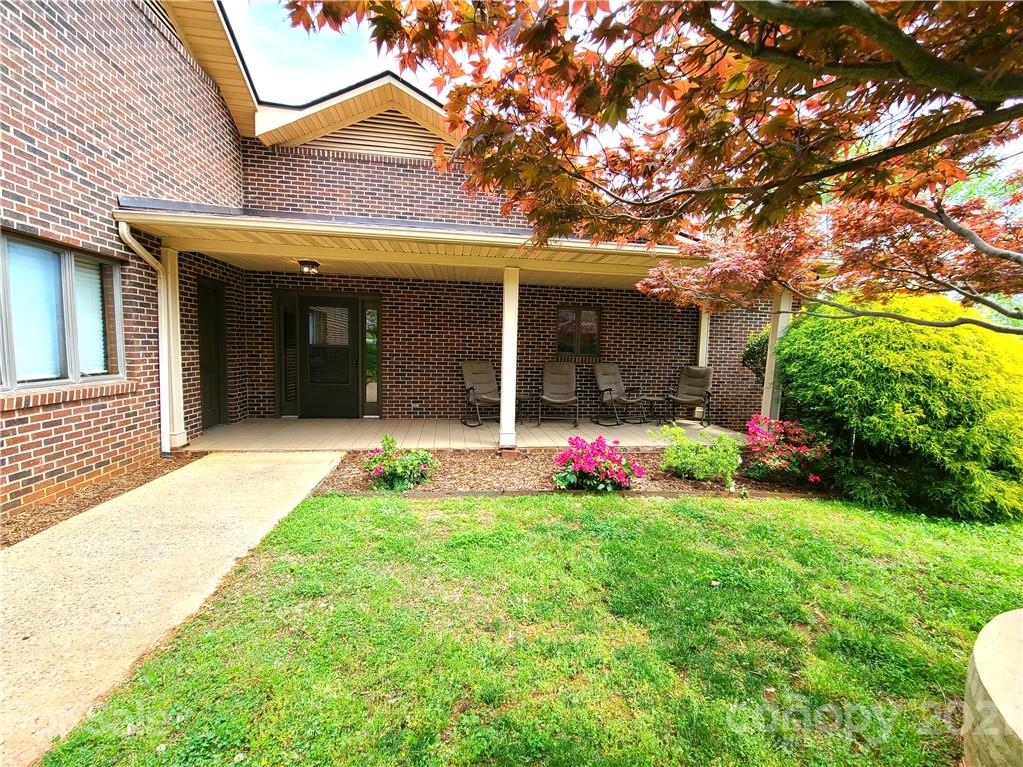 250 Tanner Street Rutherfordton, NC 28139 - Photo 6 of 48 front view of a house with a yard and potted plants