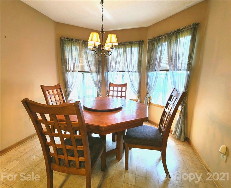 250 Tanner Street Rutherfordton, NC 28139 - Photo 9 of 48 a view of a dining room with furniture window and wooden floor