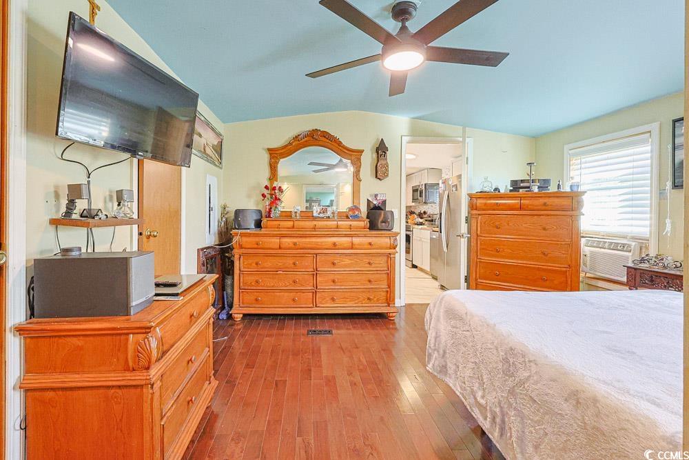1911 Abba Court Conway, SC 29526 - Photo 11 of 25 Bedroom featuring hardwood / wood-style flooring, vaulted ceiling, and ceiling fan
