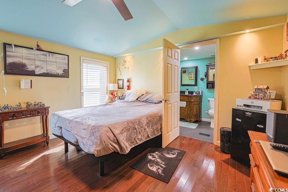 1911 Abba Court Conway, SC 29526 - Photo 12 of 25 Bedroom featuring light wood-type flooring, cooling unit, ceiling fan, and stainless steel refrigerator with ice dispenser